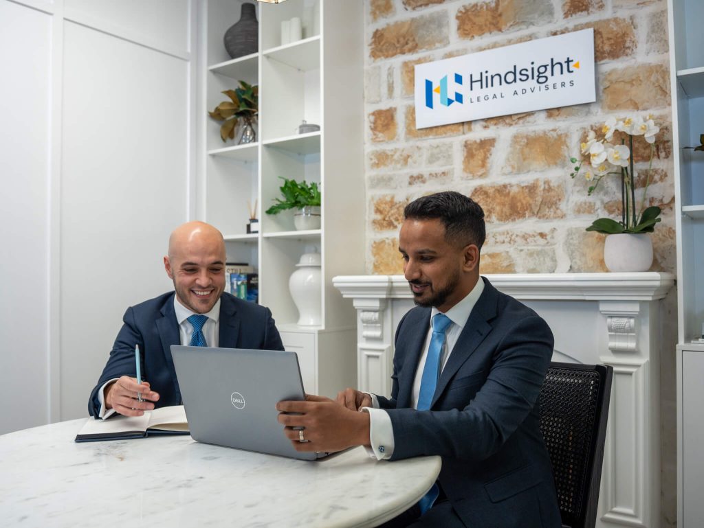 Hindsight Legal Advisers' Founding Partners reviewing a matter together